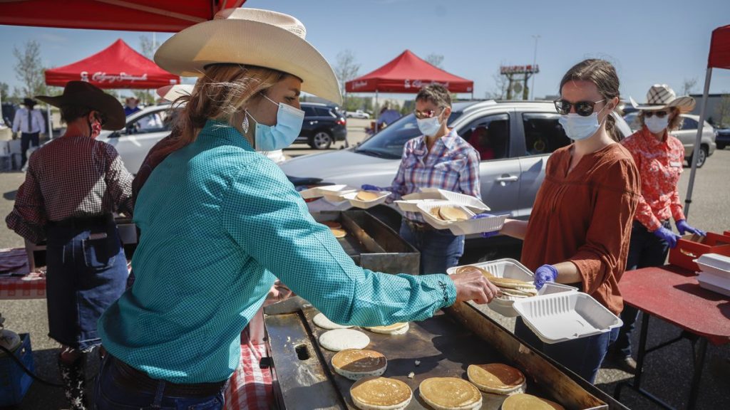 The Calgary Stampede is mostly deserted due to COVID-19, but the show must go on – The Globe and Mail