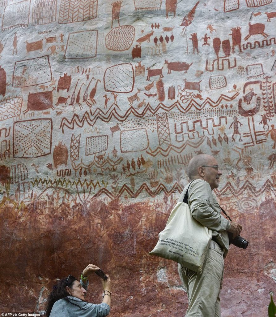 Eight-mile wall of prehistoric paintings of animals and humans is discovered in Amazon rainforest