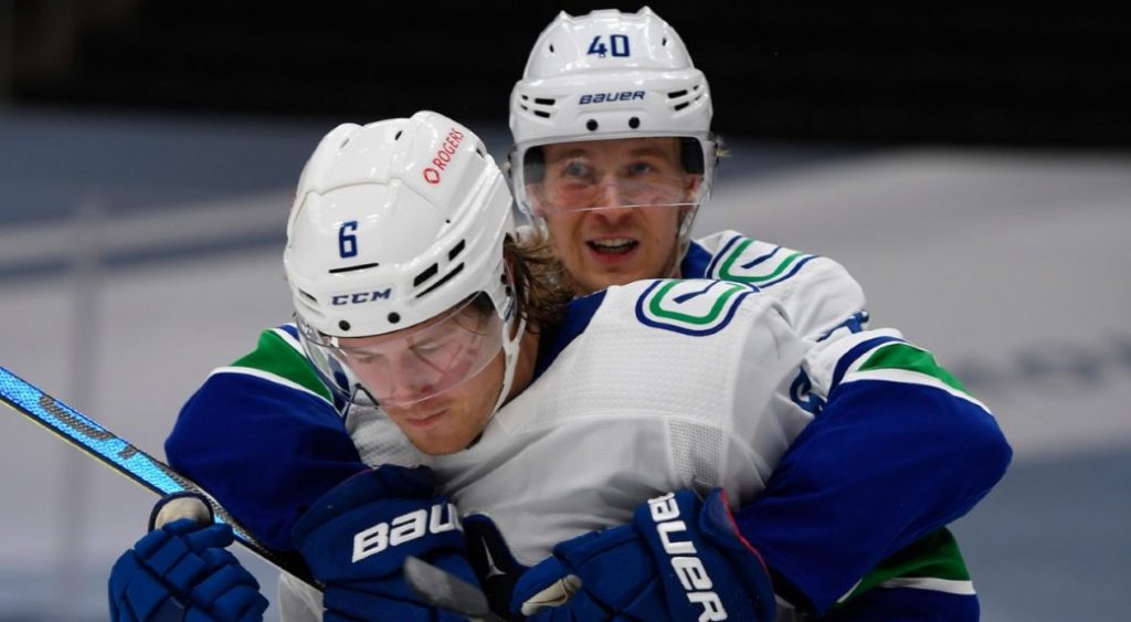 Boeser scores two as Canucks beat Oilers in season opener