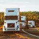 white volvo semi truck on side of road