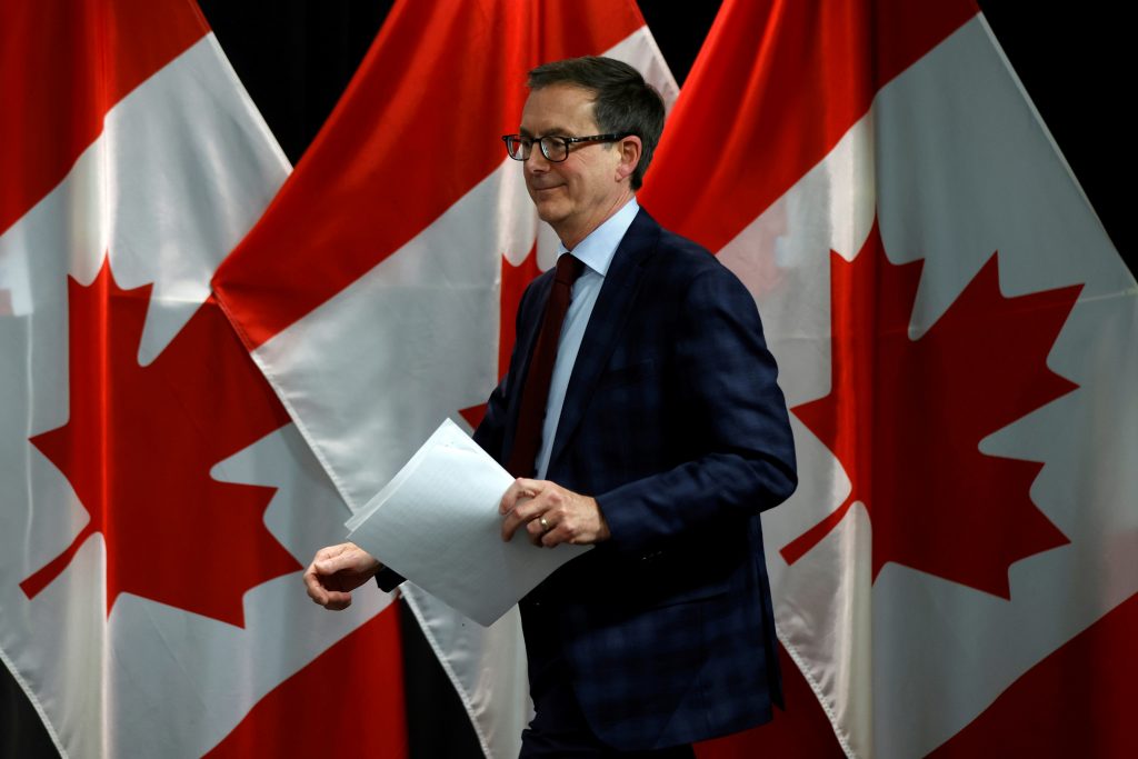 Bank of Canada holds rates, still sees economic recovery in second half
