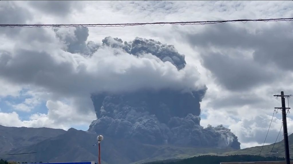 Japanese volcano spews plumes of ash, people warned away