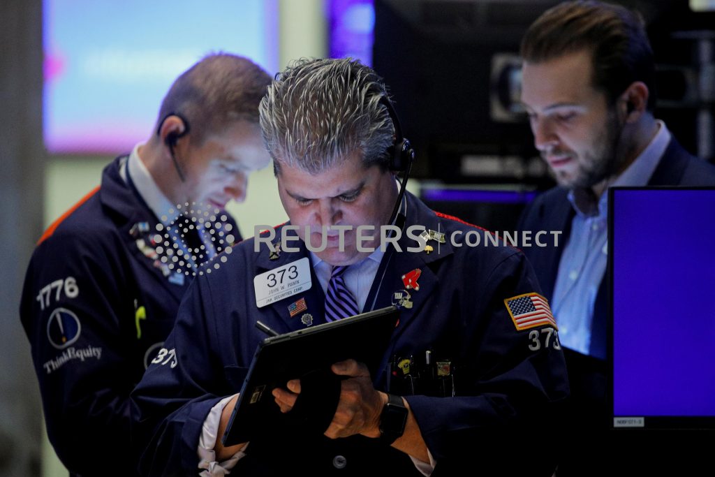 Wall Street rises as Tesla surges; focus on Fed meeting