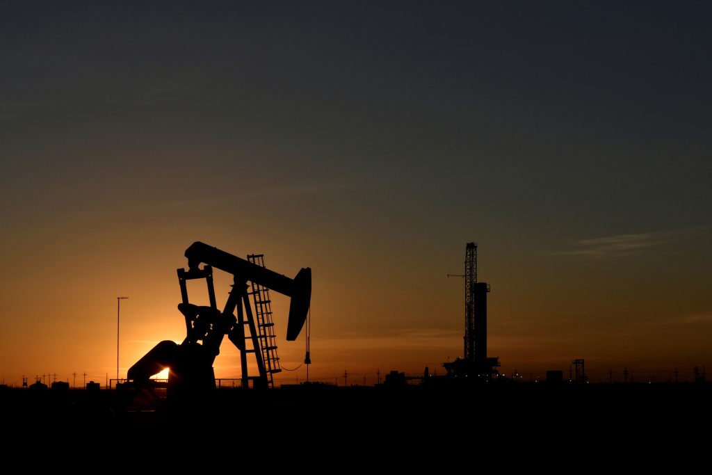 Oil prices drop on higher dollar in volatile week