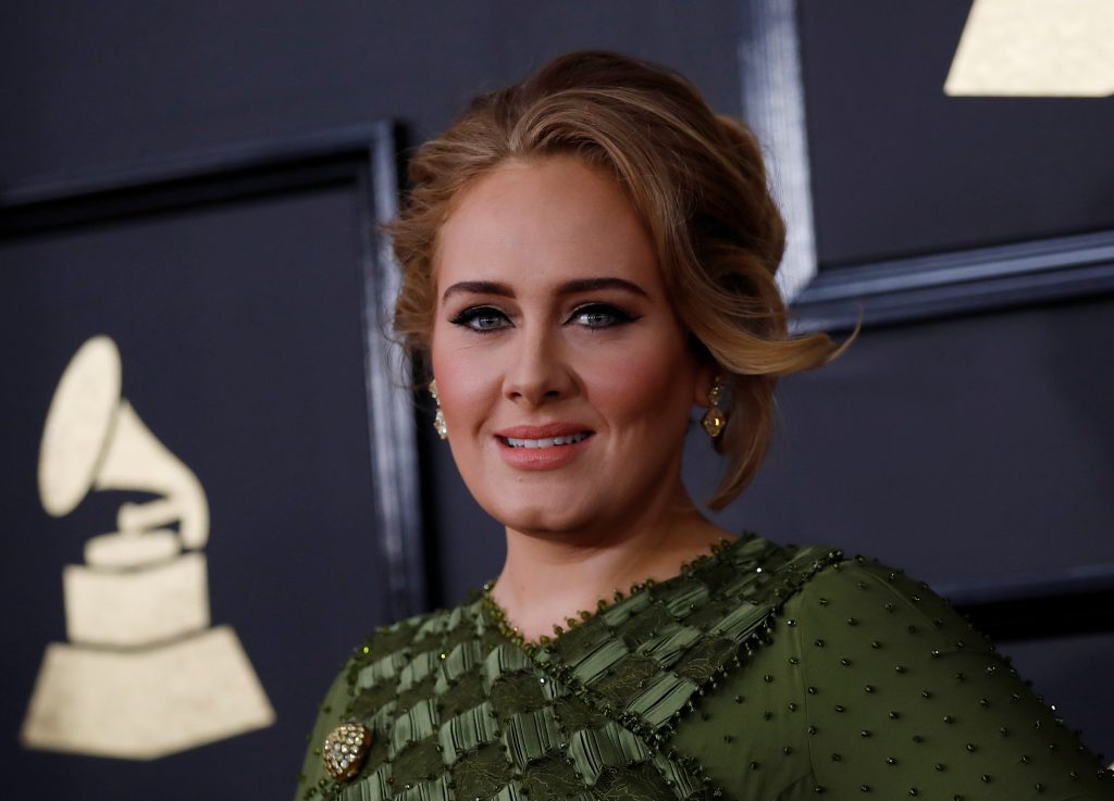 Adele tops UK music charts record-breaking comeback album “30”