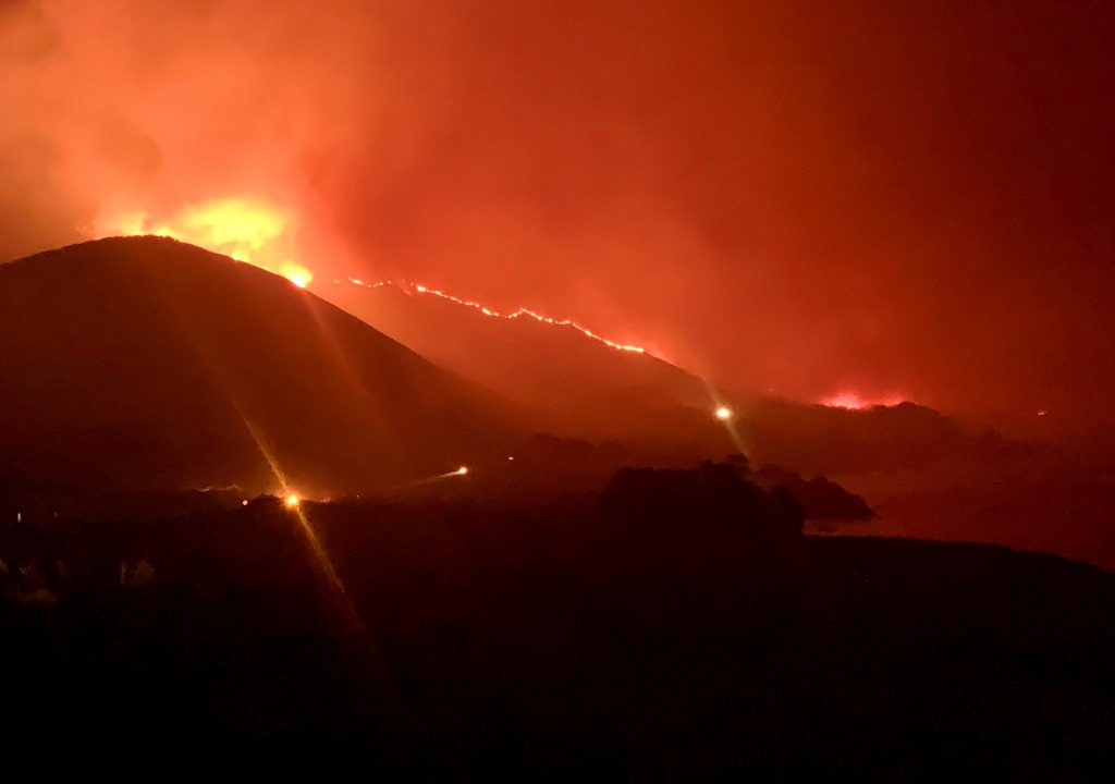 California wildfire triggers evacuations, closes highway