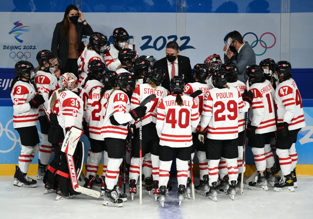Olympics-Ice hockey-Canada and ROC game gets under way after players take ice wearing masks