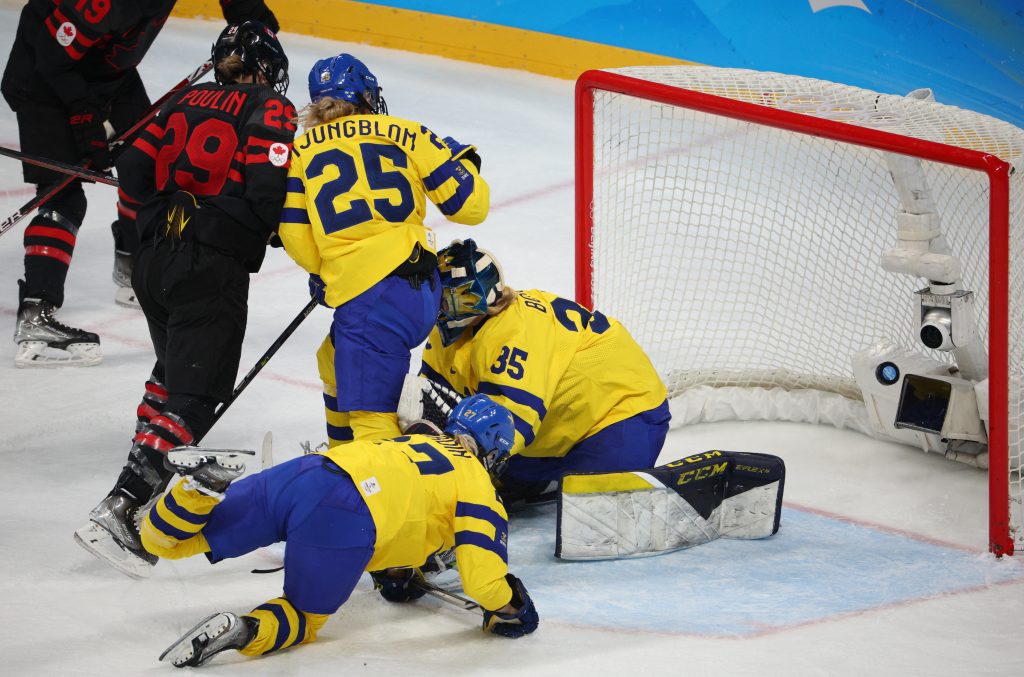 Olympics-Ice hockey-Canada engineer Swedish demolition to reach semi-final