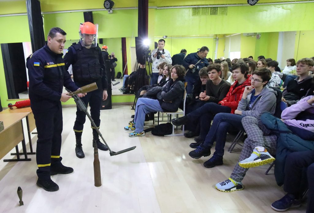 Students try bulletproof vests and escape drills in east Ukraine