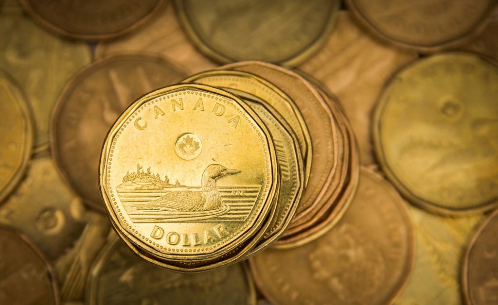 Canadian dollar notches monthly gain as safe-haven flows dominate
