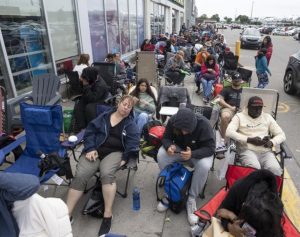 Anger, frustration and rumours outside Montreal passport office as delays continue