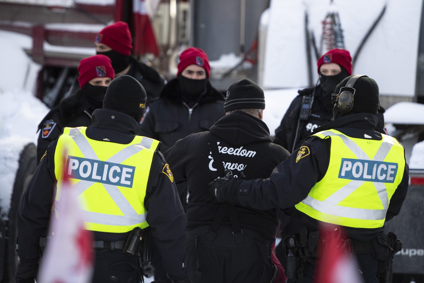 A trucker is led away after leaving his truck as police aim to end an ongoing protest against COVID-19 measures that has grown into a broader anti-government protest, on its 22nd day, in Ottawa, on Friday, Feb. 18, 2022. Ottawa's Chief of Police says they are making preparations to handle a potential second Freedom Convoy in February 2023. THE CANADIAN PRESS/Justin Tang Justin Tang