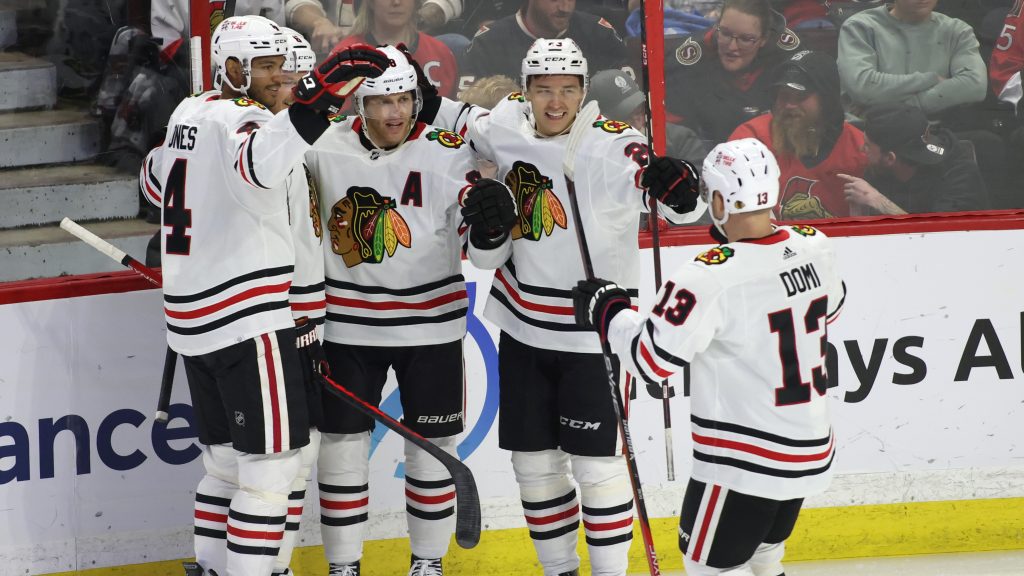 Athanasiou leads Blackhawks past Sens in OT; Neil honoured