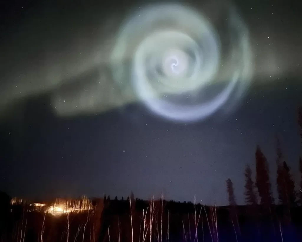 Odd spiral appears amid northern lights in Alaska night sky