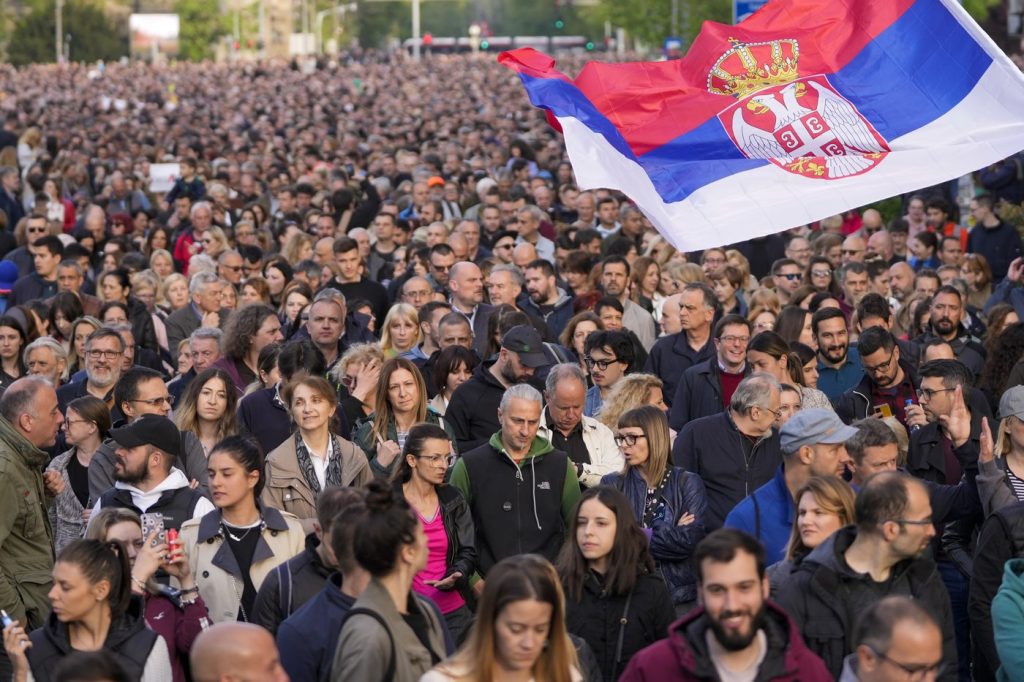 Thousands march in silence in Serbia after mass shootings