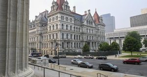Former aide to 2 New York governors is charged with being an agent of the Chinese government