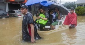 Fierce storm blows out of northern Philippines after leaving 14 dead in landslides and floods