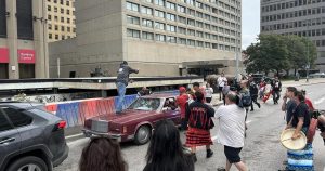 Car drives through police protest in Winnipeg, driver confronted Car drives through police protest in Winnipeg, driver confronted