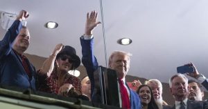 In Alabama, Trump goes from the dark rhetoric of his campaign to adulation of college football fans