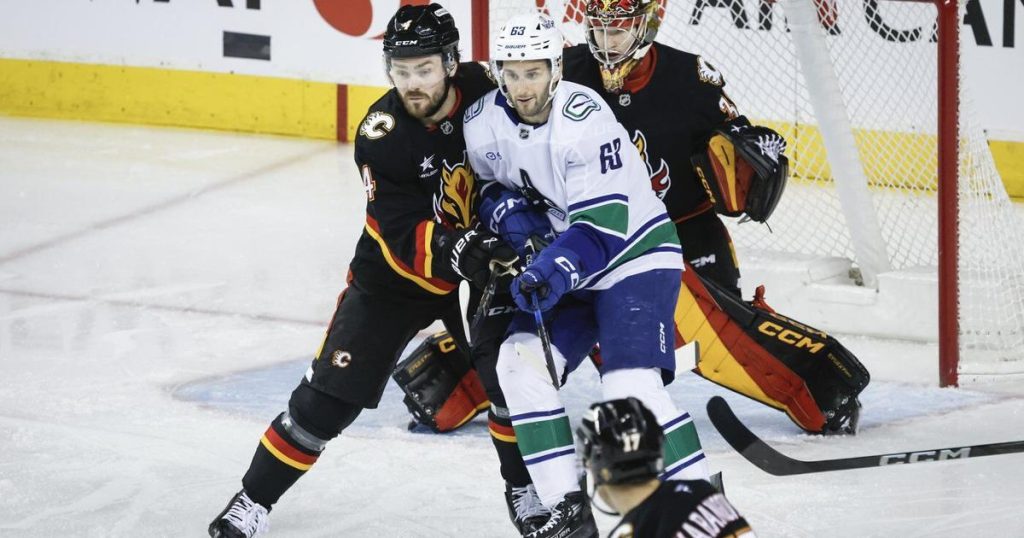 Flames bring the heat in beating struggling Canucks 3-1
