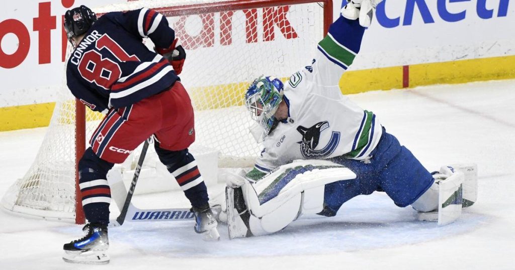Connor nets hat trick, Jets soar past Canucks 6-1