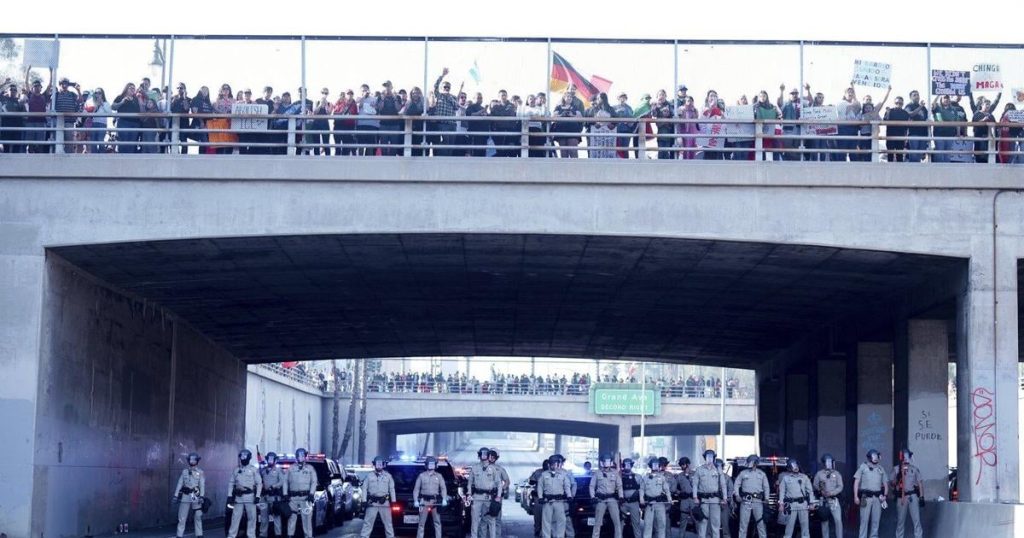 Marchers protesting planned deportations block major freeway in Los Angeles