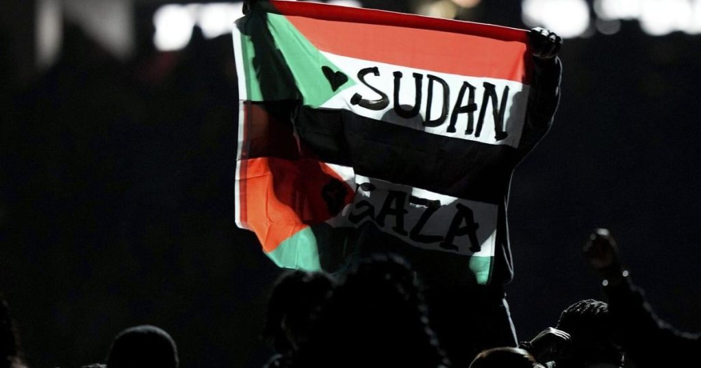 Super Bowl halftime performer detained after unfurling Sudanese-Palestinian flag