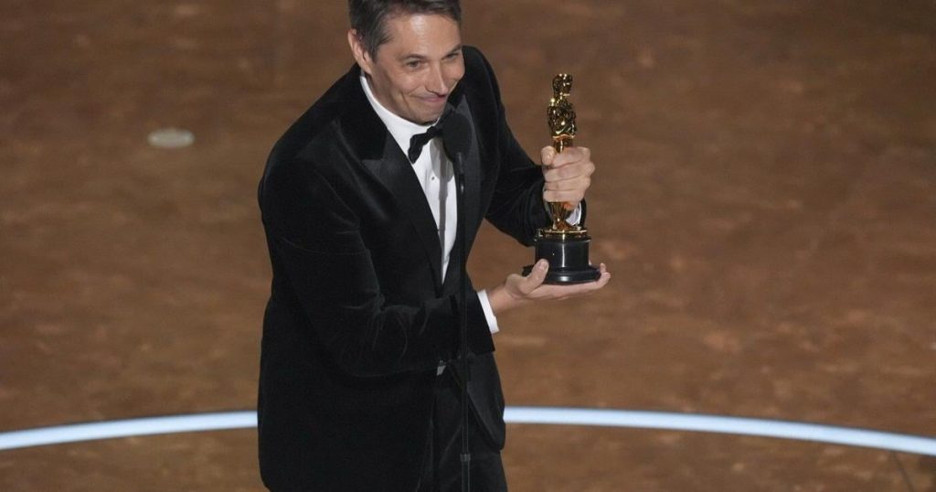 Sean Baker wins original screenplay Oscar for ‘Anora.’ ‘Conclave’ wins adapted screenplay trophy