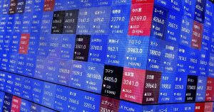 Asian shares are mixed after Wall Street briefly dips more than 10% below its record