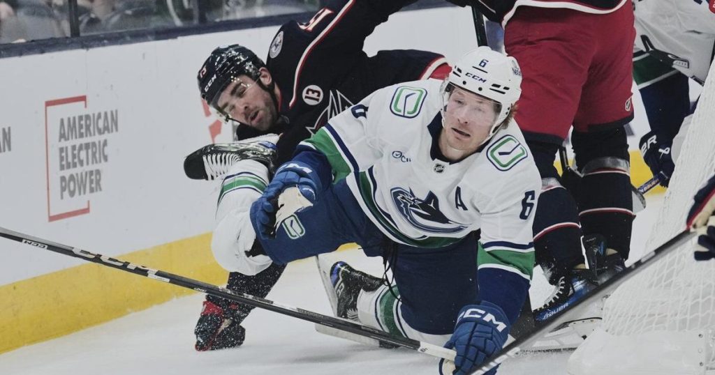 Jenner scores twice, Blue Jackets rally for 7-6 victory over Canucks in shootout