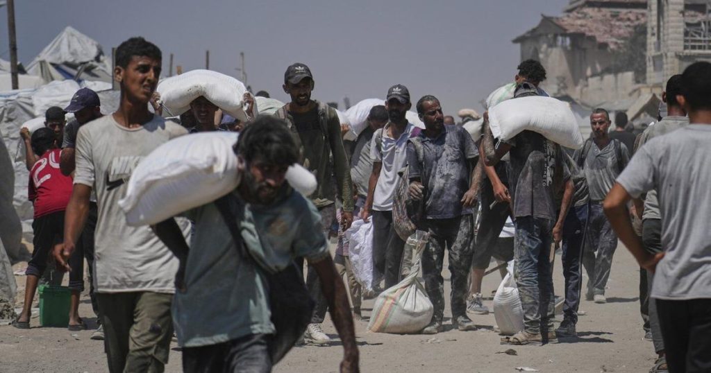 Israeli fire kills dozens in Gaza, officials say, as aid delivery remains chaotic after new measures