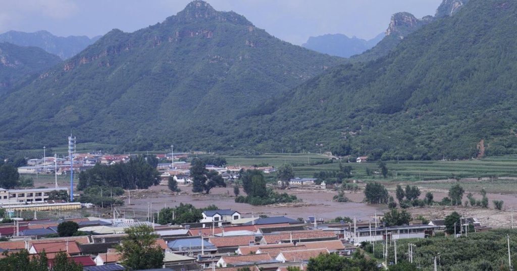 Heavy rain causes flooding, evacuations and at least 38 deaths around Beijing region