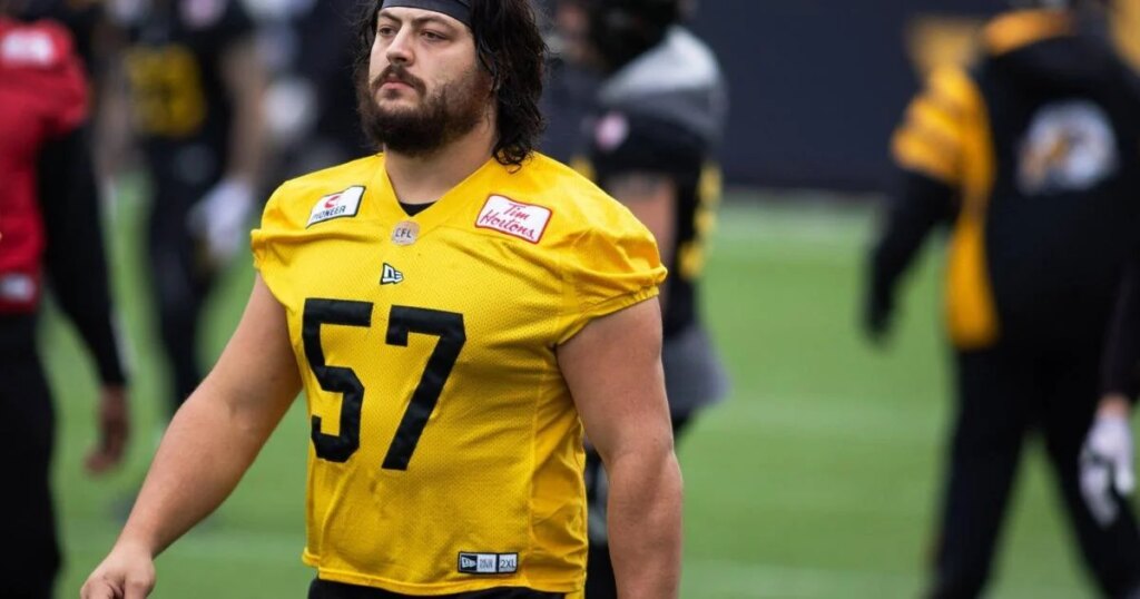 Tiger-Cats re-sign lineman Revenberg; Bombers extend defensive back Holm