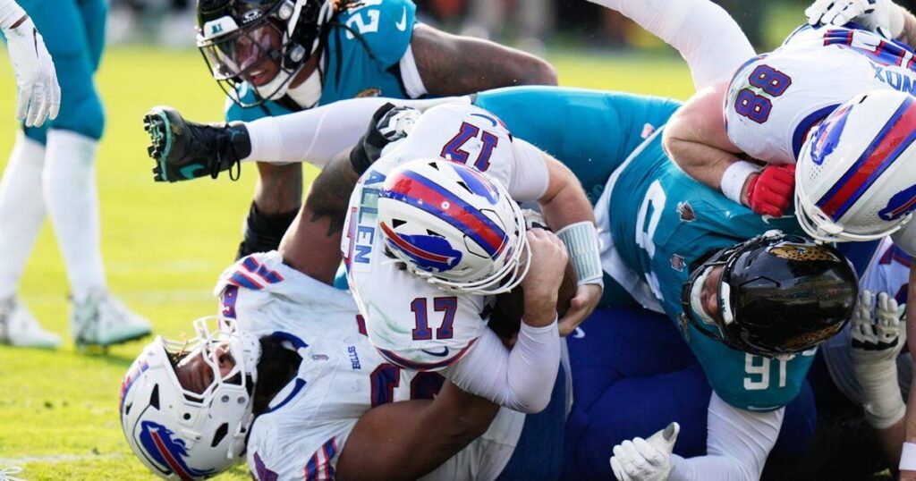 Josh Allen carries Bills to 27-24 win at Jags for Buffalo’s first road playoff victory in 33 years