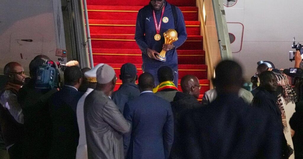Senegal President greets team as triumphant players receive heroes welcome in Dakar
