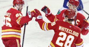 Flames ignite their offence, burn Canucks 7-3