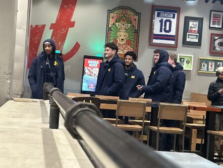 Michigan muscles its way to 2nd national title, beating stubborn UConn 69-63
