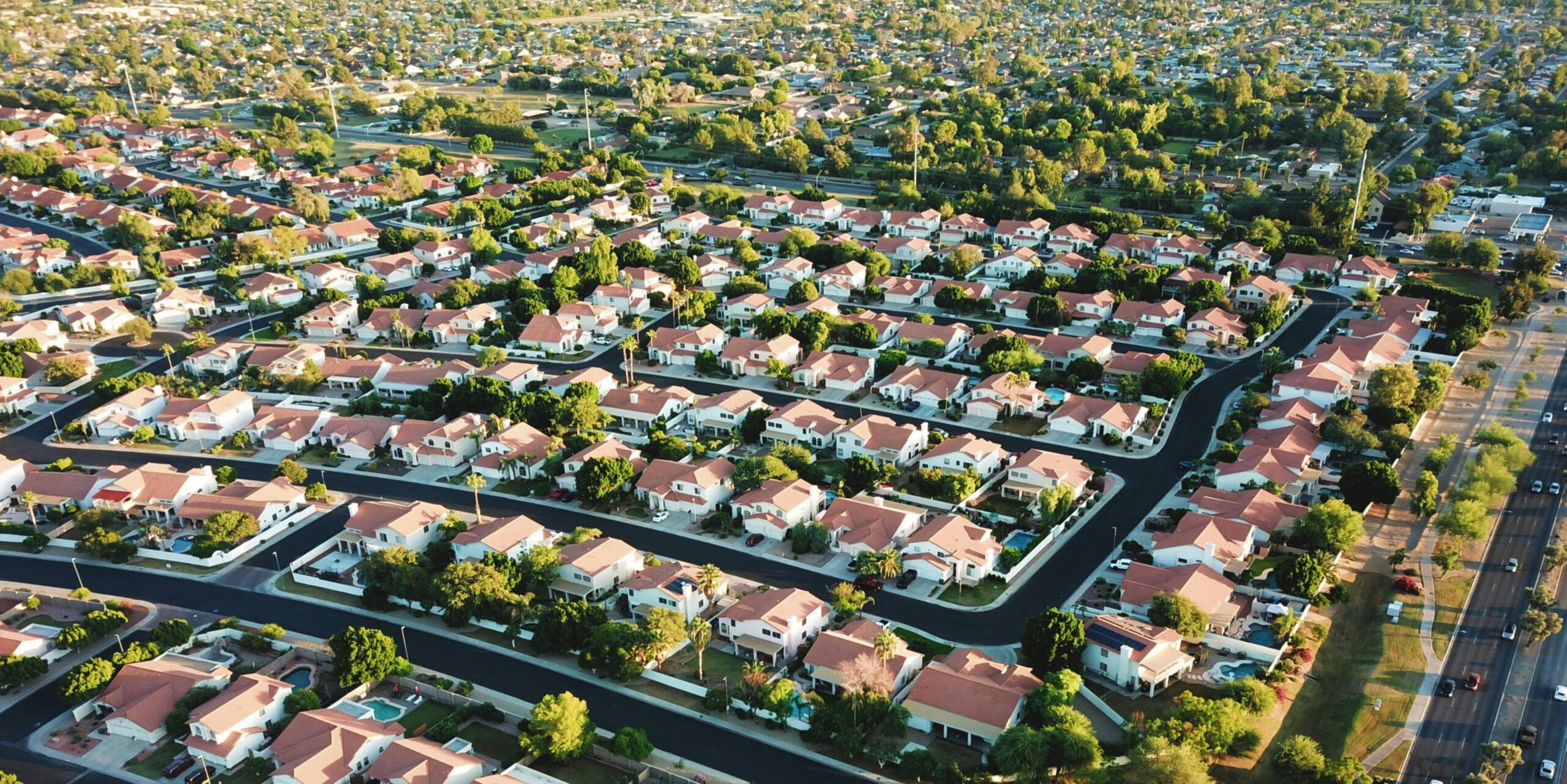 Aerial view of suburban rooftops, illustrative stock photo