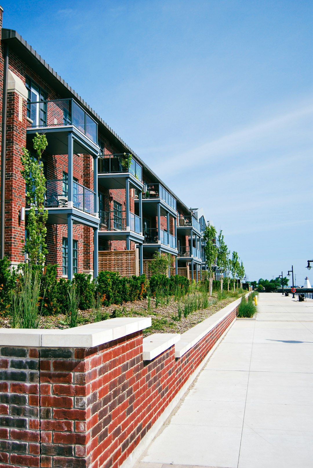 Red brick apartment building with balconies