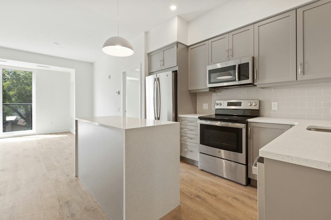 A bright white and black kitchen in an apartment, illustrative stock photo not of a specific property