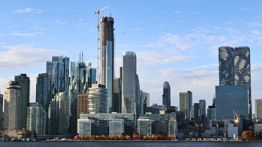 Modern city skyline with towers under a blue sky