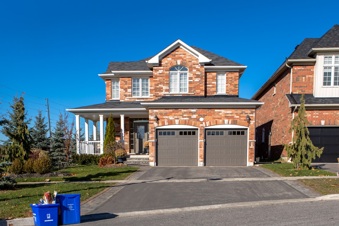 Exterior of a detached red brick family home at the end of a residential street