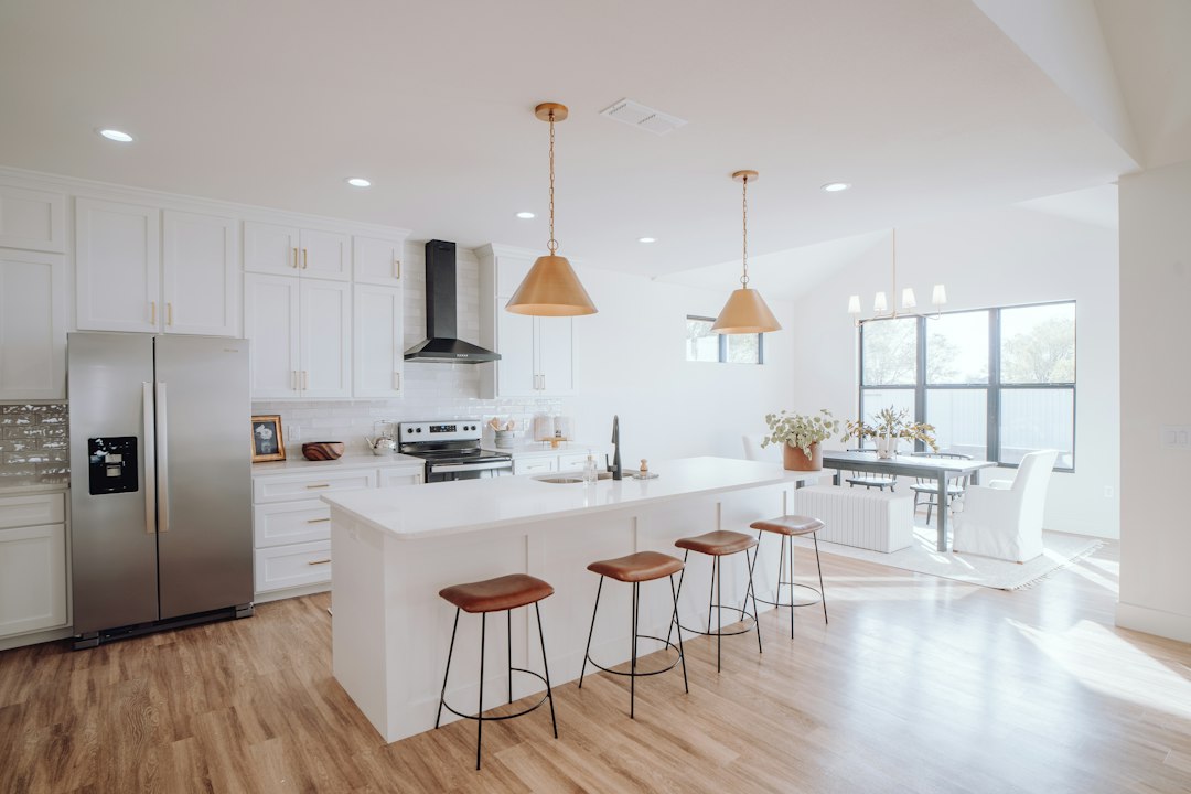 Kitchen with a centre island and stools