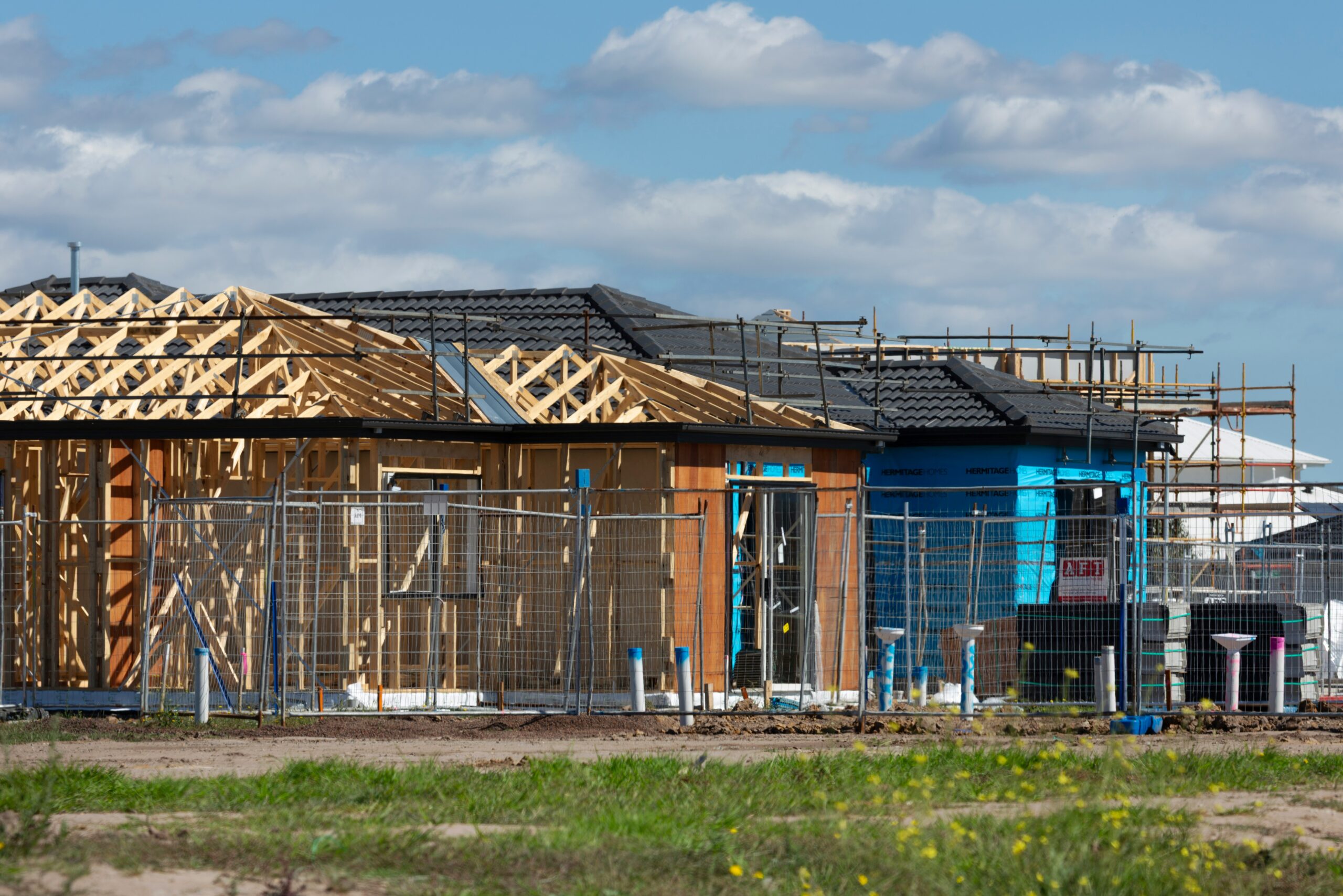 A new home under construction on a residential building lot