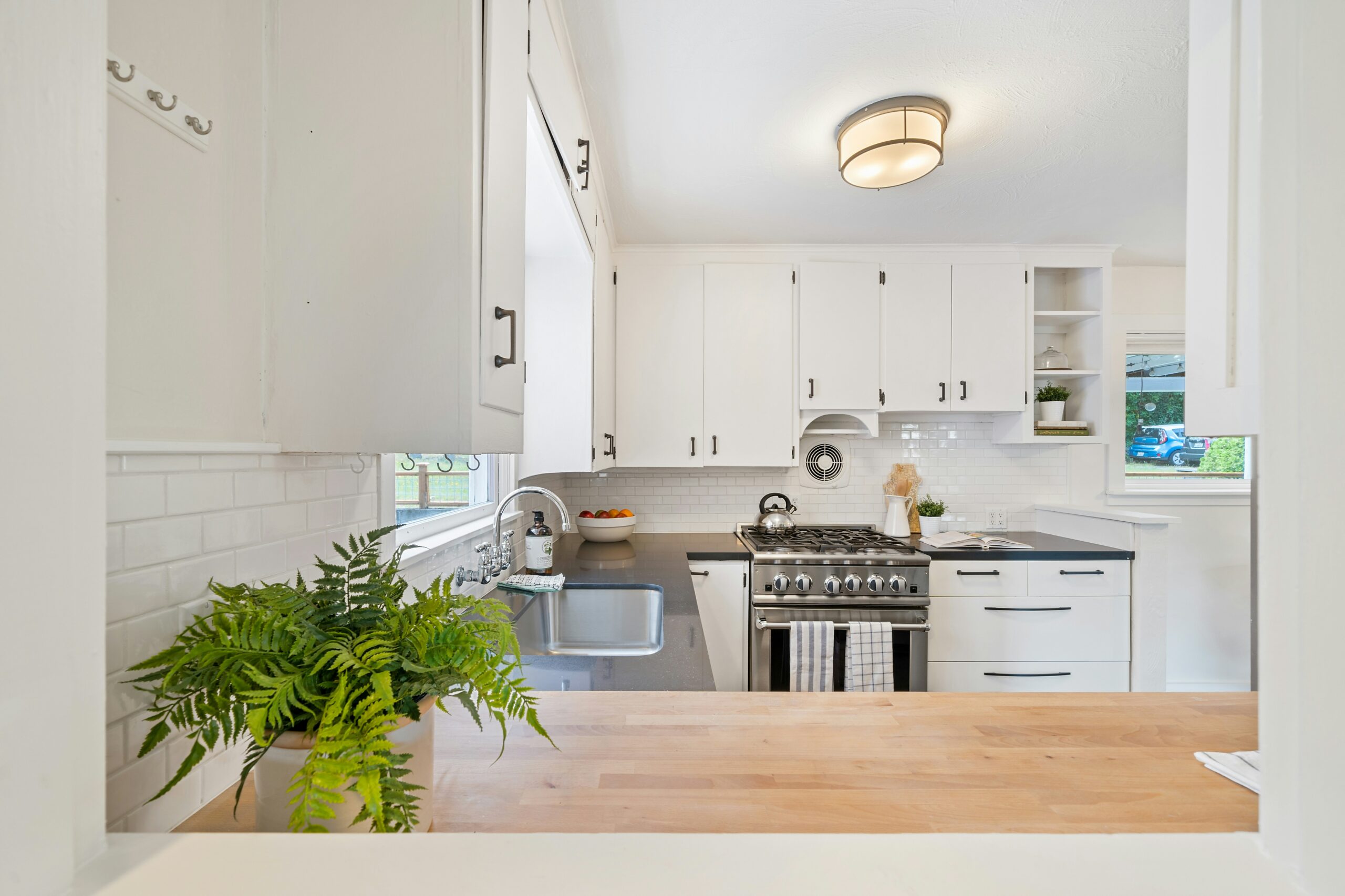 Bright kitchen with white cabinets in a rental apartment