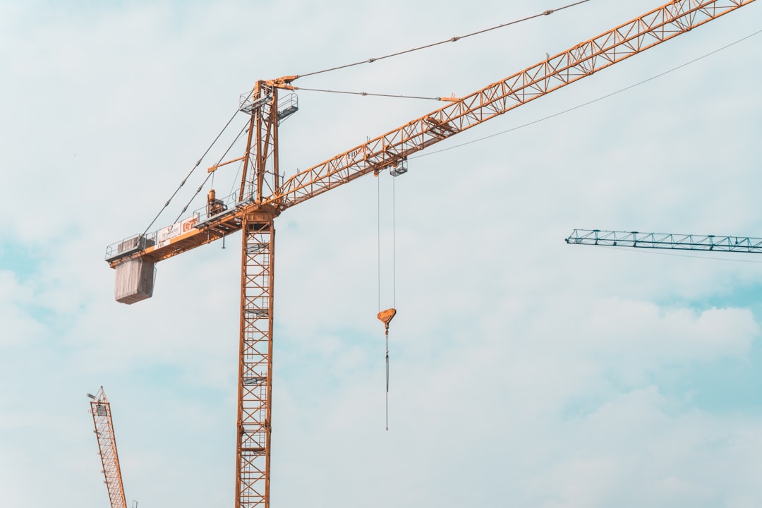 Construction cranes over a residential building site