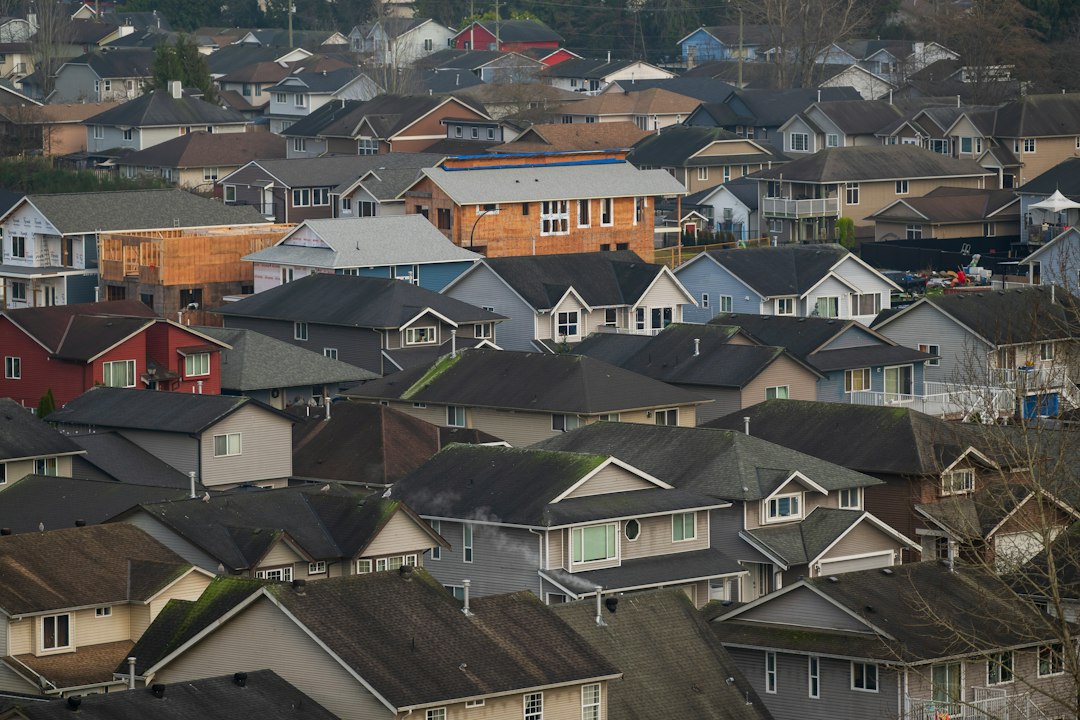 Illustrative stock photo of a residential neighbourhood of houses, not a photo of a specific property mentioned in this report