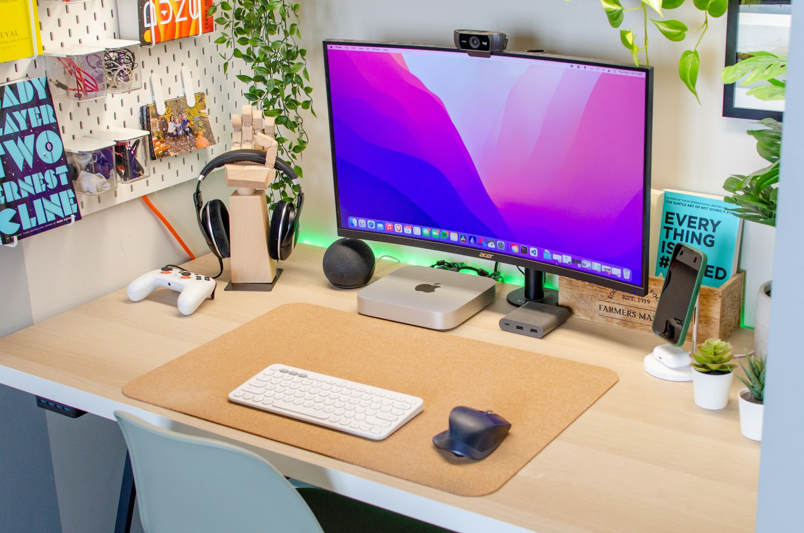 A 4K monitor on a wooden desk in a home office