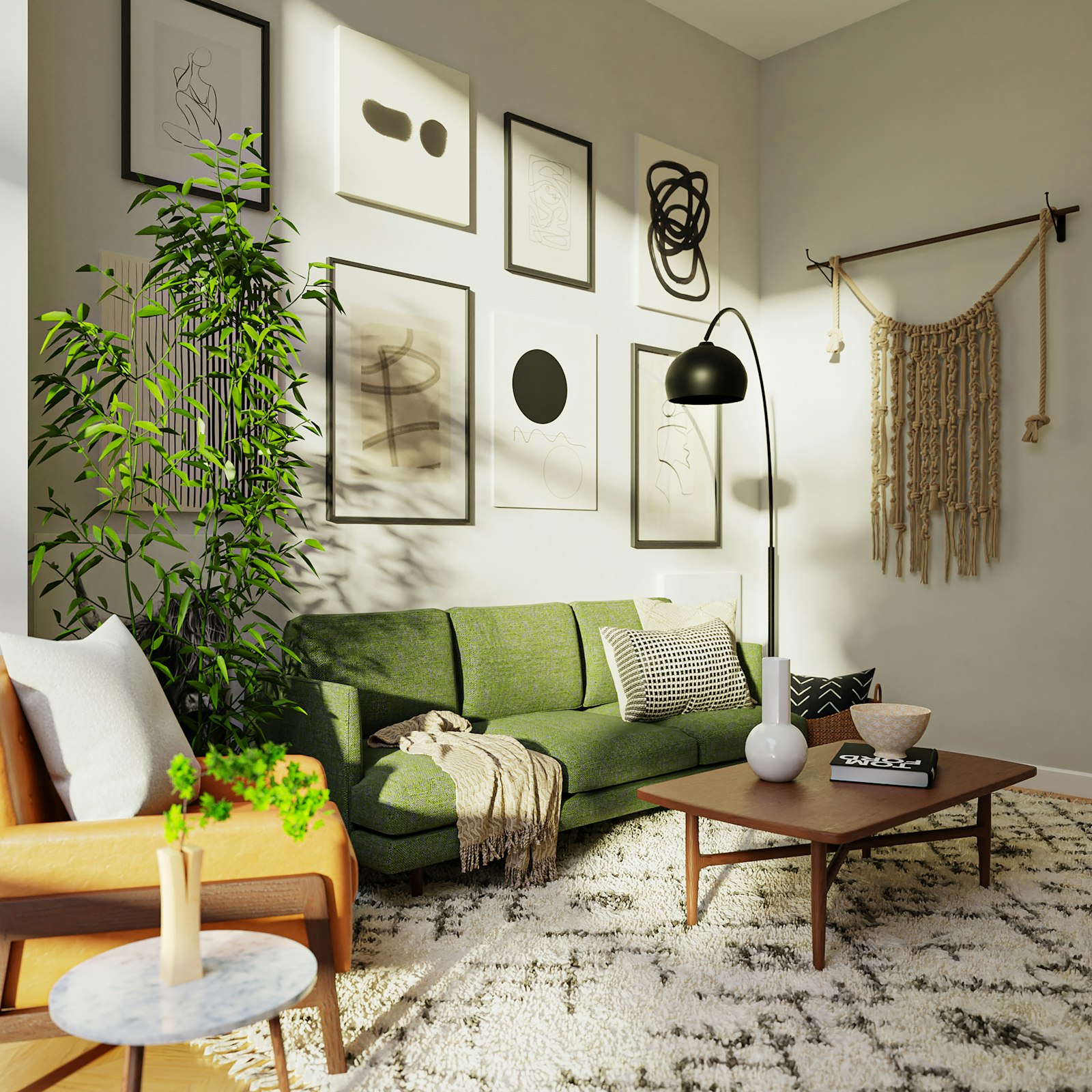 Gallery wall of prints above a green sofa with sunlight on the wall