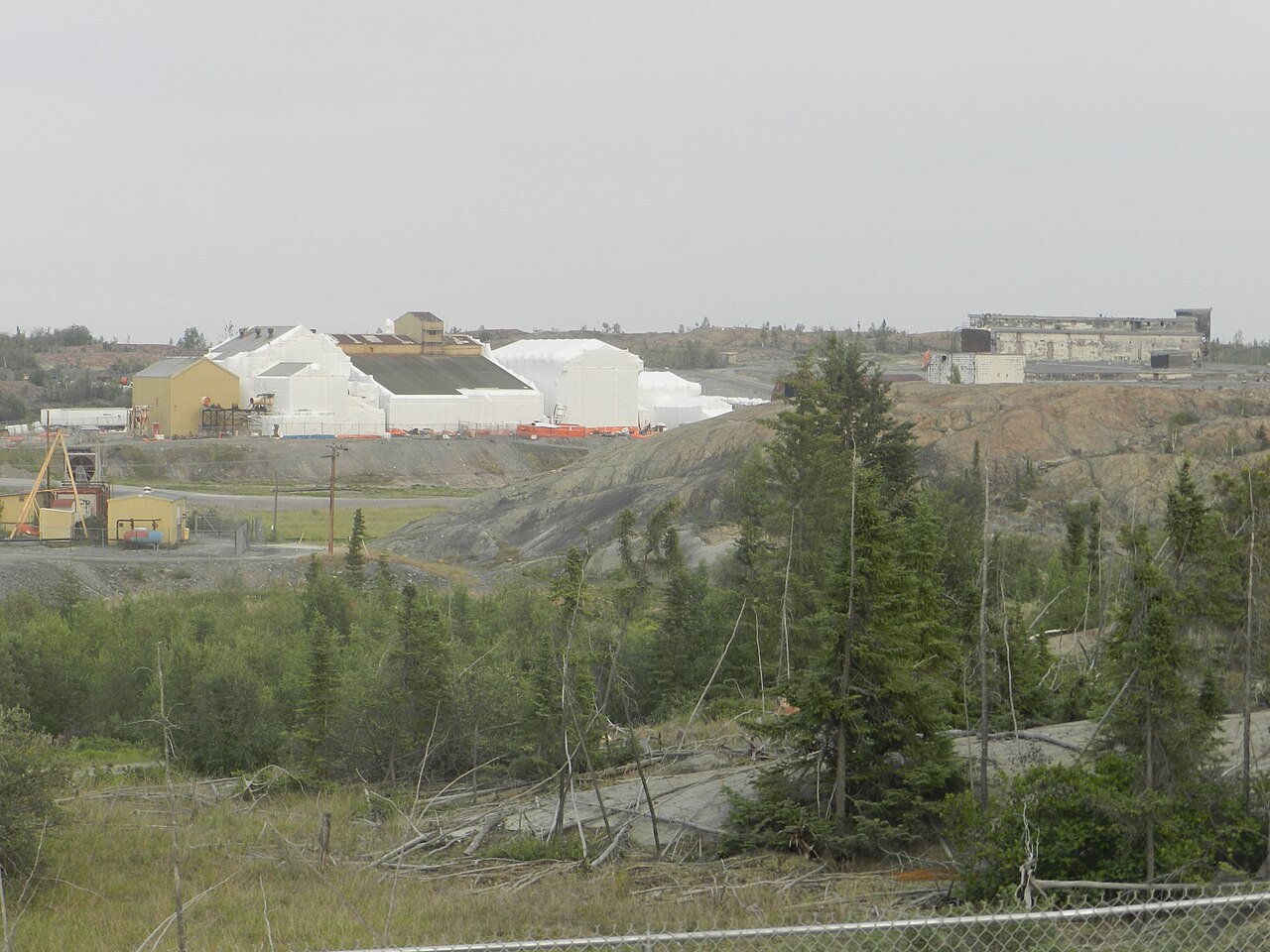 Buildings wrapped in white containment sheeting at the Giant Mine remediation site in Yellowknife, 2014